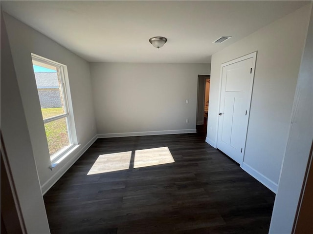 9198 Ofallon Dr N, Mobile, AL 36695 - unfurnished dining area with plenty of natural light, baseboards, and dark wood-style flooring