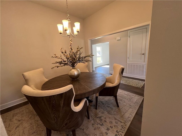 9198 Ofallon Dr N, Mobile, AL 36695 - dining space with a chandelier, lofted ceiling, wood finished floors, and baseboards