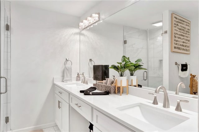 bathroom with tile patterned flooring, vanity, and a shower with shower door