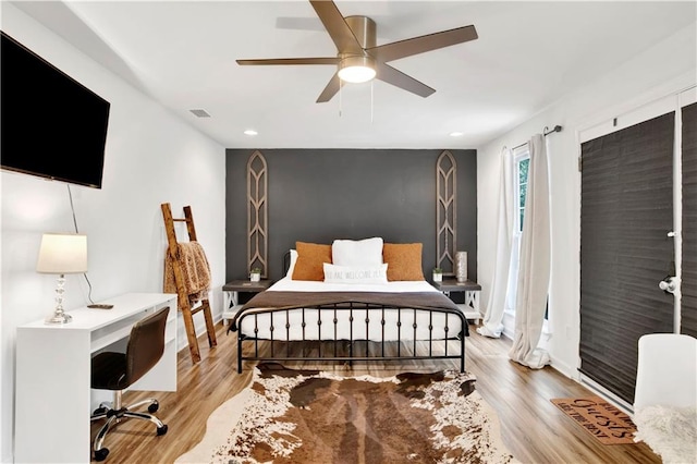 bedroom featuring light hardwood / wood-style flooring and ceiling fan