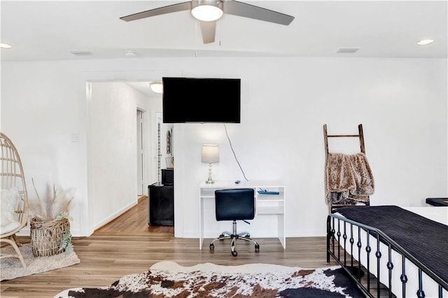 bedroom featuring ceiling fan and hardwood / wood-style floors