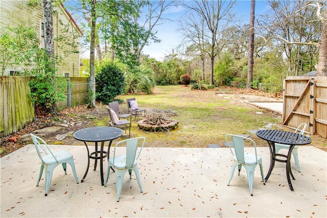 view of patio / terrace with an outdoor fire pit