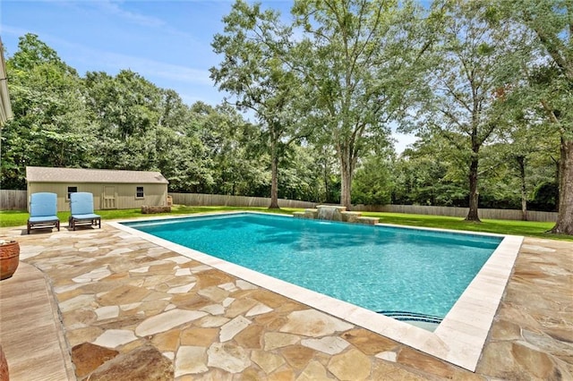 view of swimming pool with a fenced in pool, a patio, an outdoor structure, and a fenced backyard