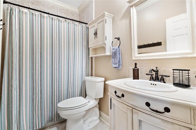 bathroom with tile patterned flooring, toilet, and vanity