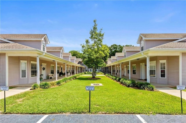 view of home's community with a lawn