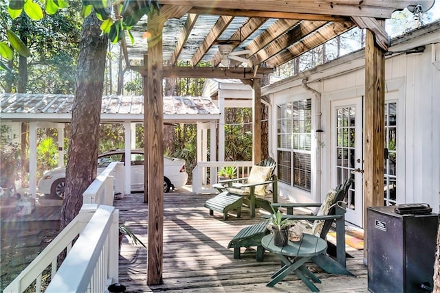 wooden terrace featuring french doors and a gazebo