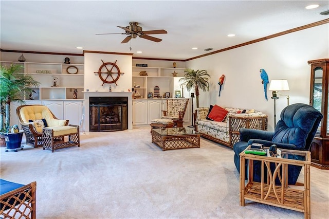 carpeted living room featuring ceiling fan and crown molding