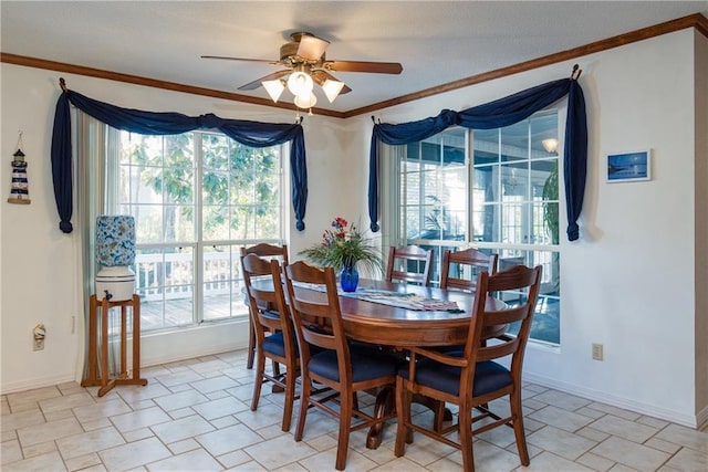 tiled dining room featuring a wealth of natural light, crown molding, and ceiling fan