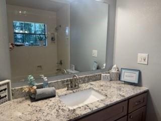 bathroom featuring vanity and tub / shower combination