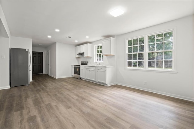 912 David Langan Dr W, Mobile, AL 36608 - unfurnished living room featuring recessed lighting and wood finished floors