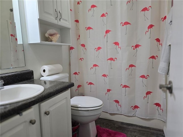 full bathroom featuring vanity, toilet, wood-type flooring, and shower / bath combo