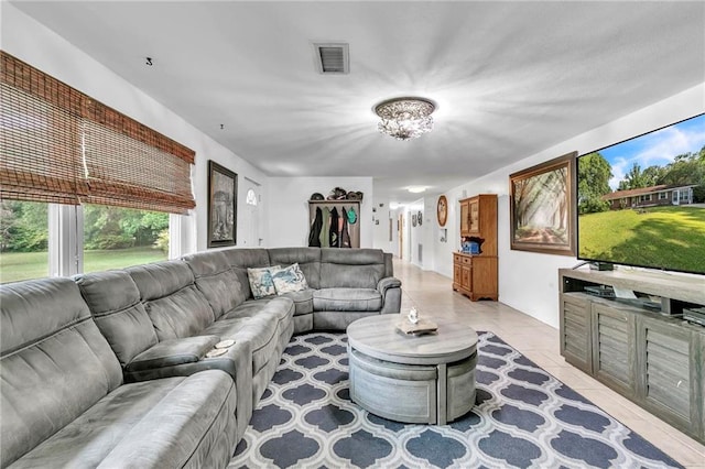 18127 County Road 10th Rd, Foley, AL 36535 - living room featuring visible vents, light tile patterned floors, and an inviting chandelier