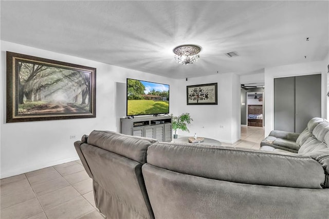 18127 County Road 10th Rd, Foley, AL 36535 - living room with visible vents, baseboards, light tile patterned floors, and a notable chandelier