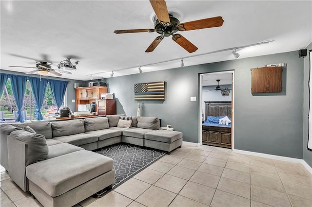 18127 County Road 10th Rd, Foley, AL 36535 - living room featuring light tile patterned floors, track lighting, ceiling fan, and baseboards