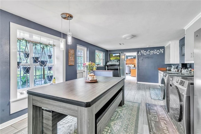 18127 County Road 10th Rd, Foley, AL 36535 - dining room featuring independent washer and dryer, baseboards, and light wood-type flooring