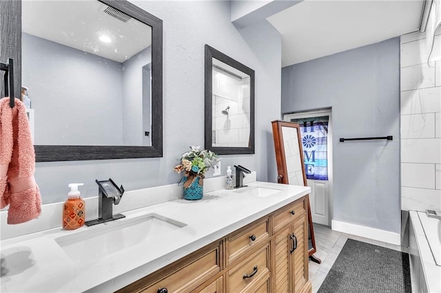 18127 County Road 10th Rd, Foley, AL 36535 - full bathroom with double vanity, a bathtub, and a sink