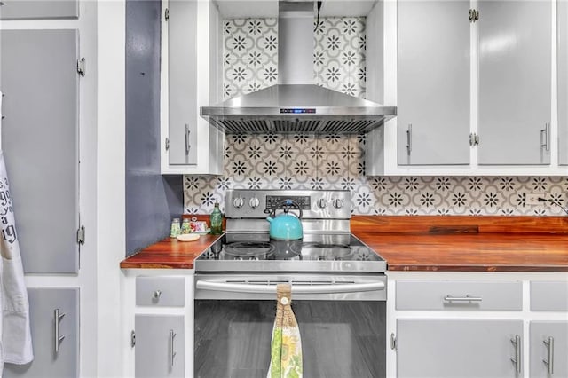 18127 County Road 10th Rd, Foley, AL 36535 - kitchen with wall chimney range hood, decorative backsplash, wooden counters, and stainless steel range with electric stovetop