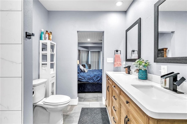 18127 County Road 10th Rd, Foley, AL 36535 - ensuite bathroom with double vanity, toilet, recessed lighting, a sink, and ensuite bath