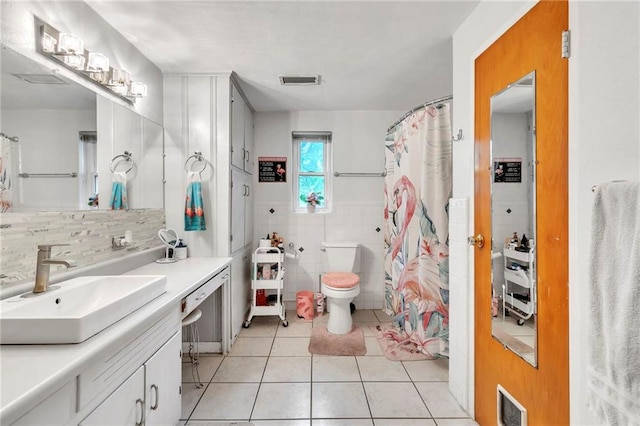 18127 County Road 10th Rd, Foley, AL 36535 - bathroom featuring visible vents, tile patterned floors, tile walls, and vanity