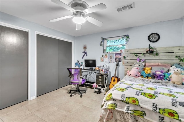18127 County Road 10th Rd, Foley, AL 36535 - bedroom featuring visible vents, tile patterned floors, a ceiling fan, and two closets