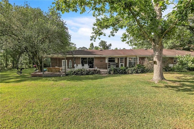 18127 County Road 10th Rd, Foley, AL 36535 - rear view of property with a yard and brick siding