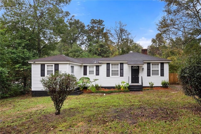 single story home featuring a front yard