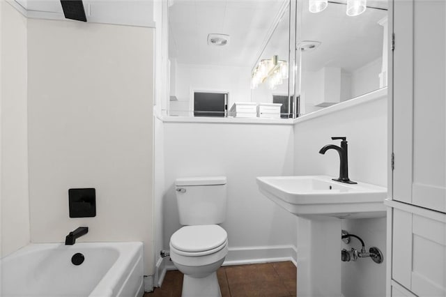 full bathroom featuring tile patterned floors, toilet, washtub / shower combination, and sink