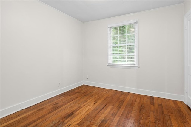 empty room with hardwood / wood-style floors