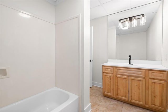 bathroom with vanity, tile patterned floors, and  shower combination