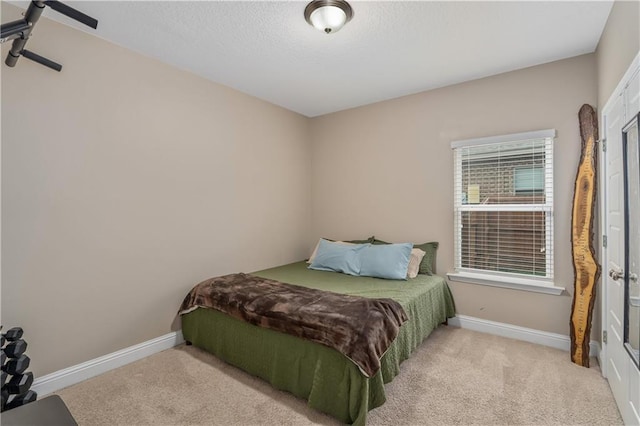 bedroom featuring light colored carpet