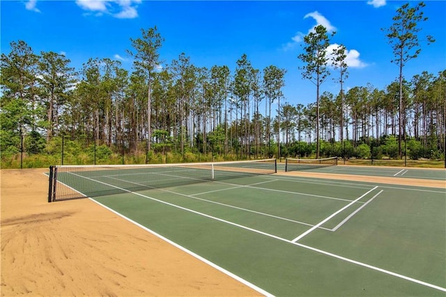 view of sport court featuring basketball hoop