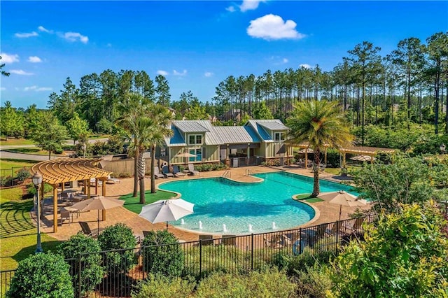 view of swimming pool with a pergola and a patio area