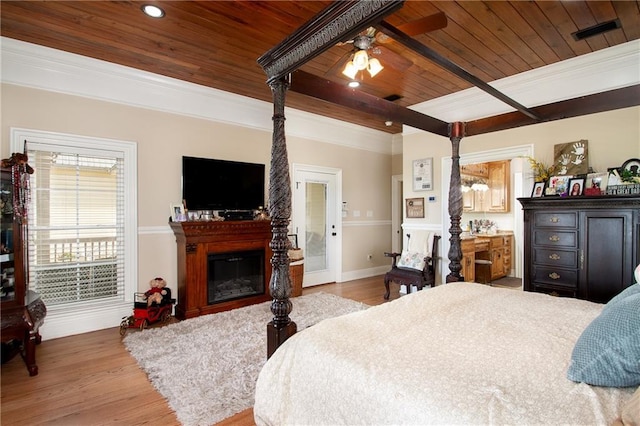 bedroom featuring crown molding, wooden ceiling, and hardwood / wood-style flooring