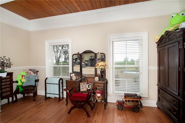 sitting room featuring crown molding, hardwood / wood-style floors, and wooden ceiling