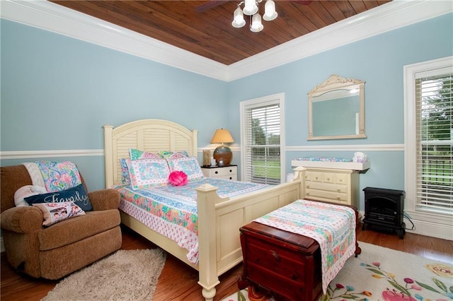 bedroom featuring crown molding, wooden ceiling, and wood-type flooring