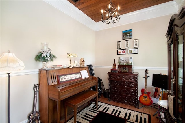 misc room with a notable chandelier, hardwood / wood-style floors, wooden ceiling, and crown molding