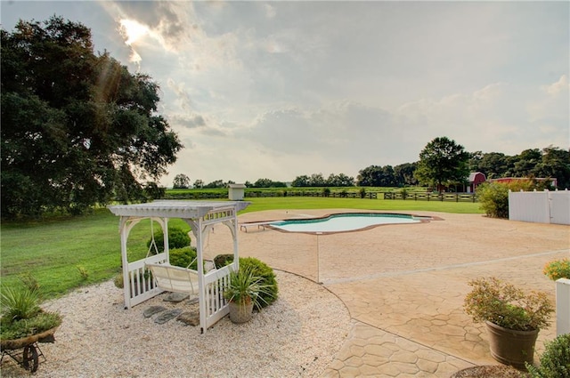 view of pool featuring a pergola, a patio, and a yard