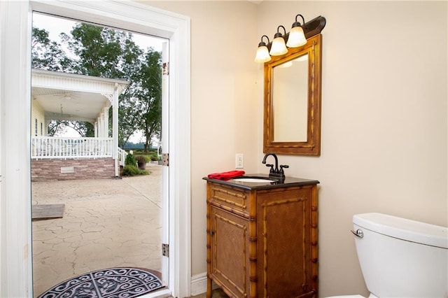 bathroom with toilet and vanity