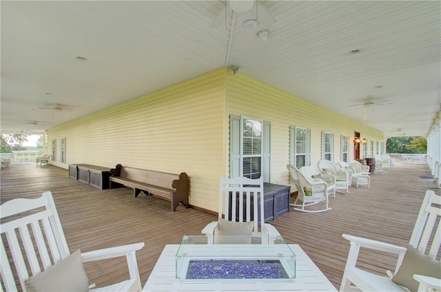 wooden deck with ceiling fan