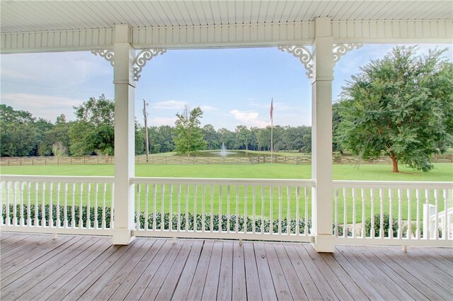 deck featuring a lawn