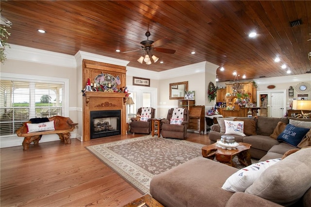 living room featuring hardwood / wood-style flooring, crown molding, and wood ceiling