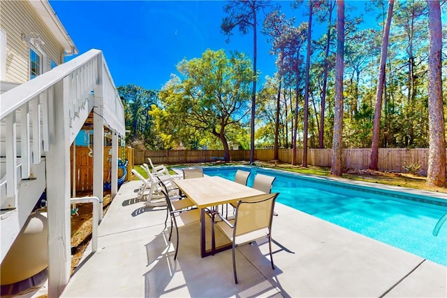 view of swimming pool with a patio area