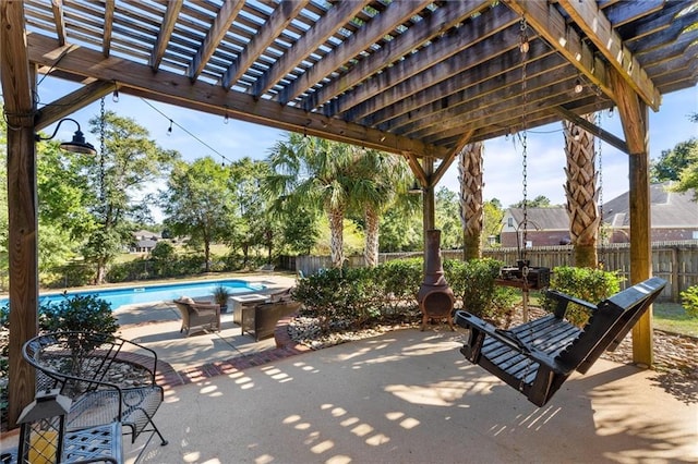 view of patio featuring a pergola and a fenced in pool