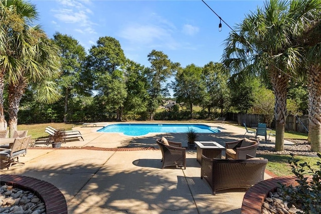 view of swimming pool with a patio