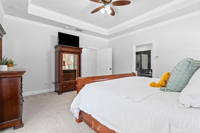 carpeted bedroom with ornamental molding, a raised ceiling, and ceiling fan