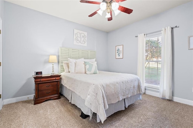 bedroom with light carpet and ceiling fan