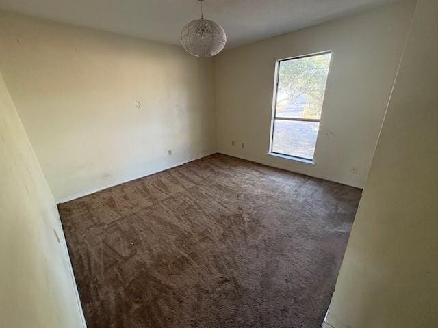 spare room featuring carpet flooring