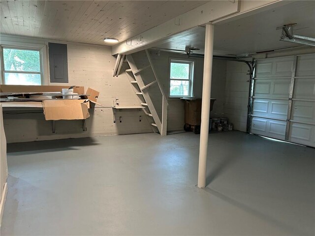 garage featuring wood ceiling and electric panel