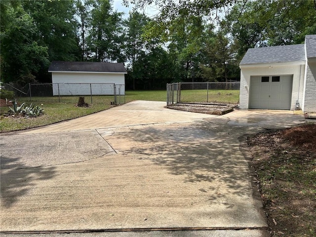 exterior space featuring fence and concrete driveway