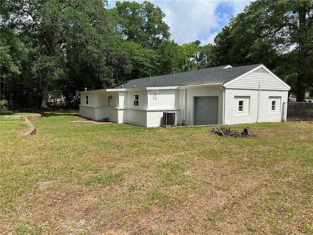 garage with fence and cooling unit